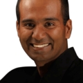Headshot of Rama Sreenivasan against a white background